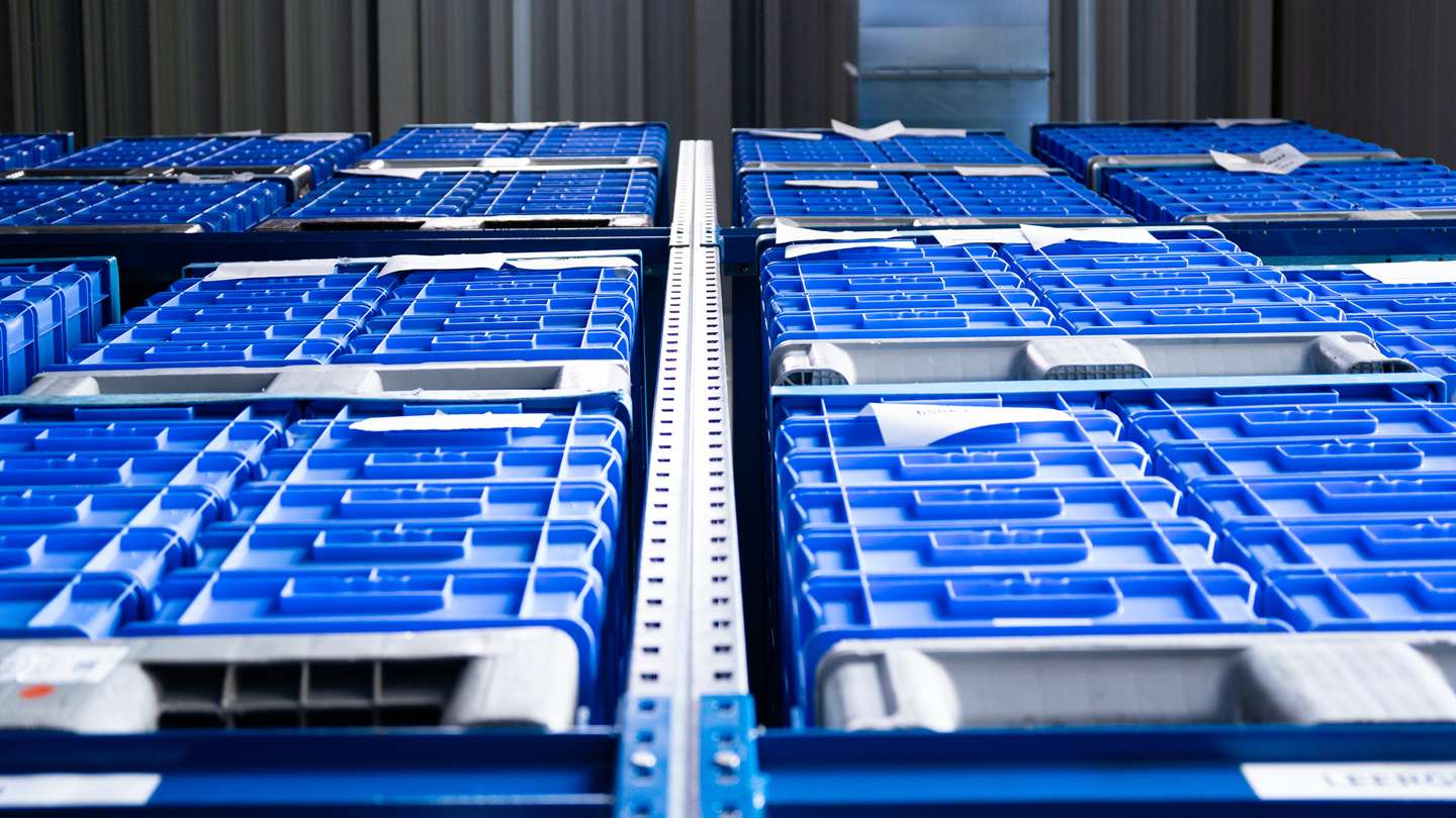 Stack of blue transport boxes for efficient logistics and material flow