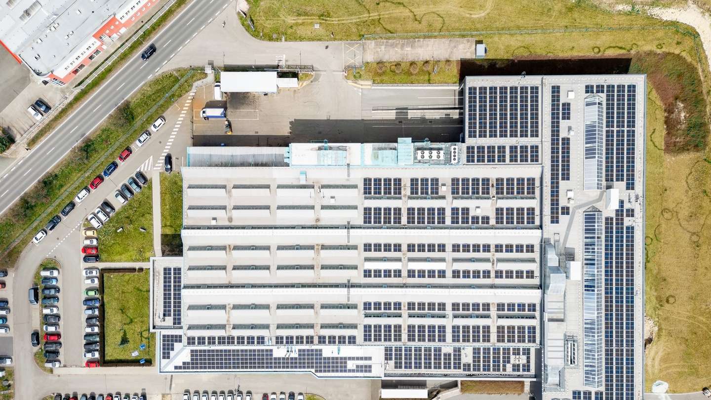 Drone shot of the company mesa parts with solar panels on the roof