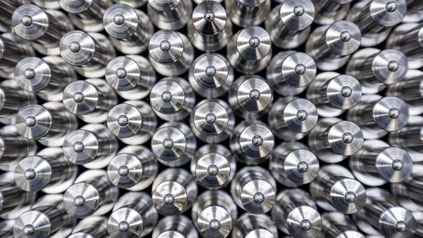 Stacked precision metal turned parts from mesa parts in close-up